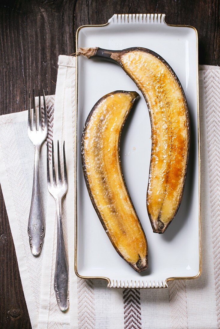 Caramelised bananas on a white platter
