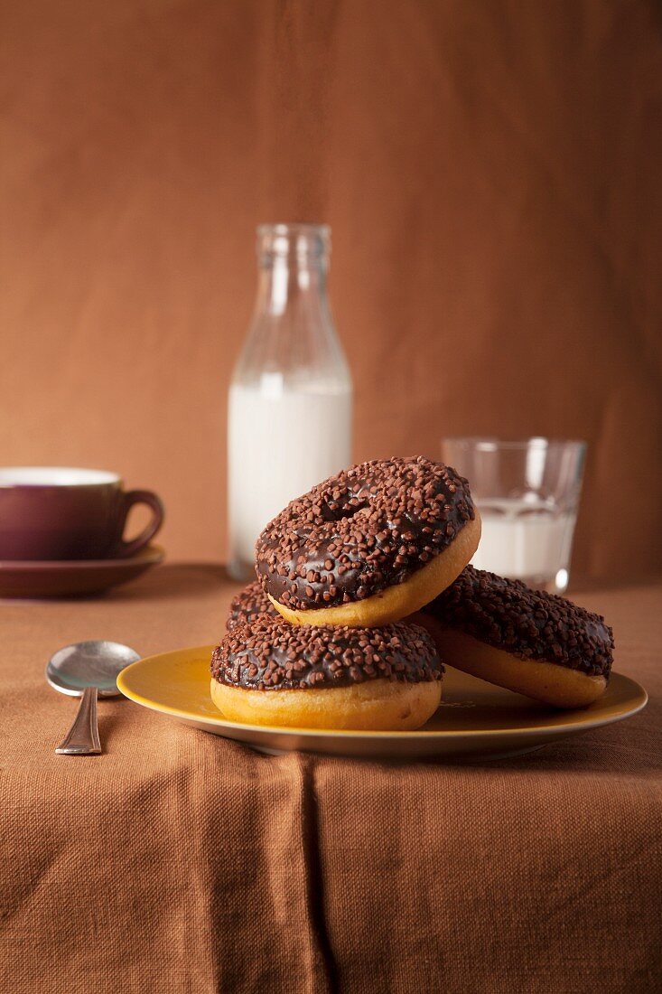 Chocolate doughnuts with milk and coffee