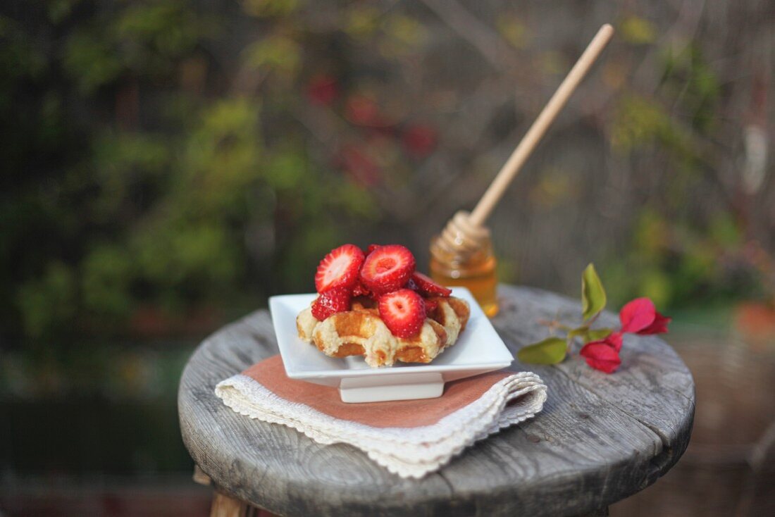 Waffles with strawberries and honey