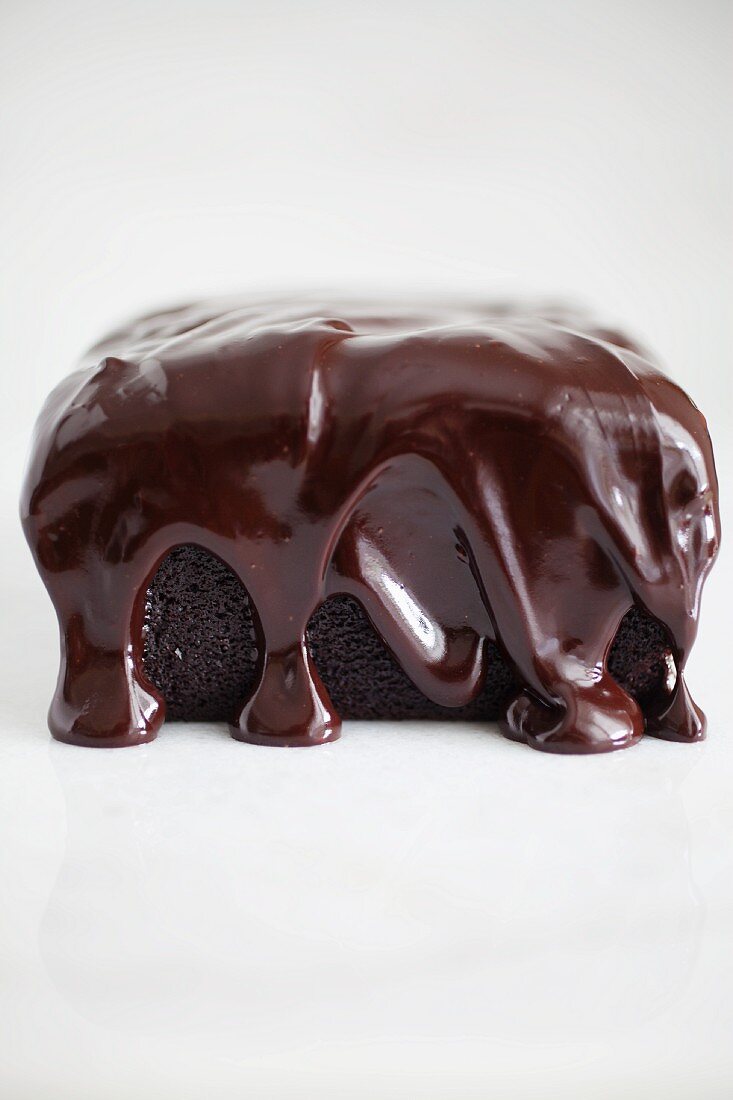 A vegan chocolate cake with a ganache glaze