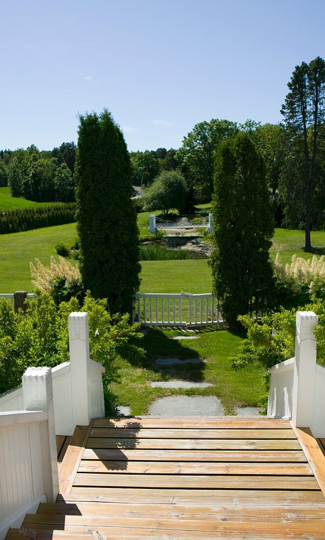 Broad flight of steps leading down into landscaped garden