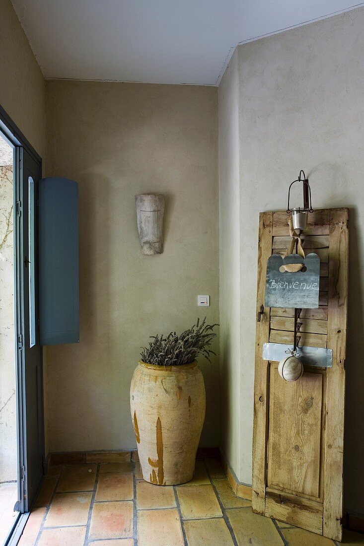 Welcome sign on old board in foyer of restored Provençal guest house