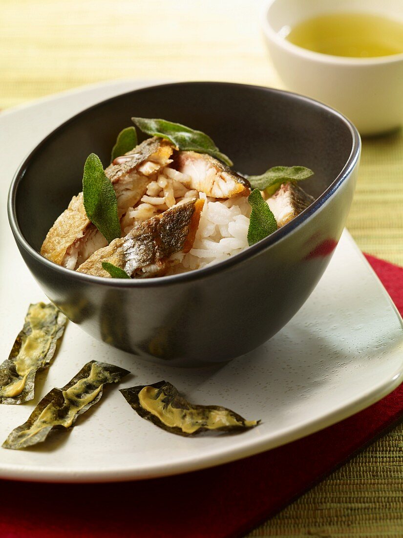 Seabream fillet on a bed of rice with sage