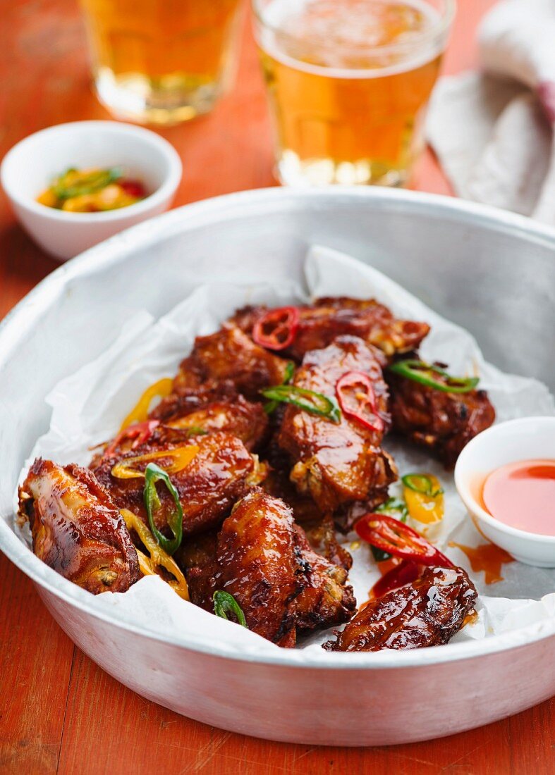 Chicken wings with chilli sauce and beer