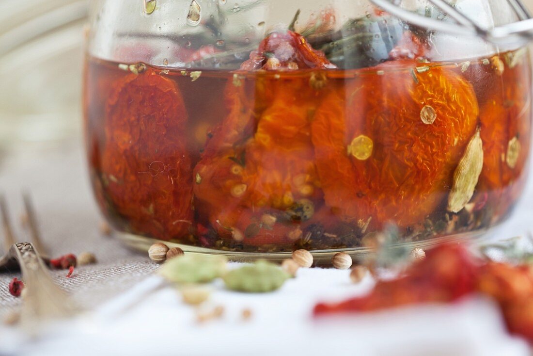 A marinade made from dried tomatoes, olive oil and rosemary (close-up)