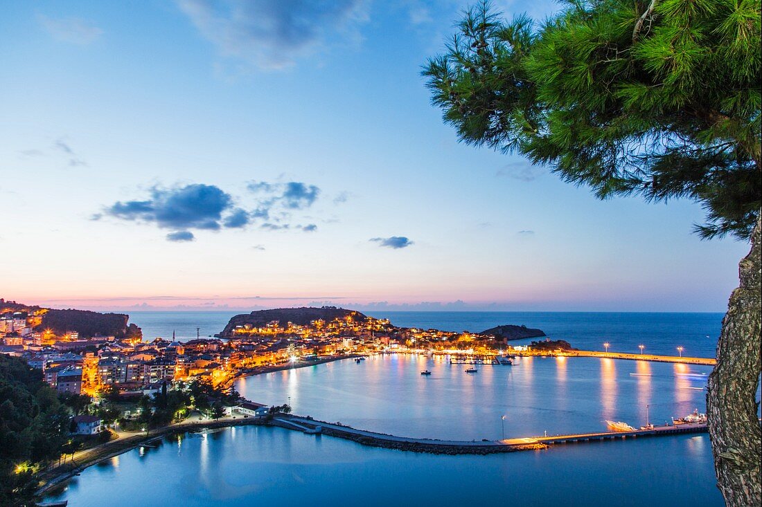 A view the town of Amasra, Turkey, located on two island, with the illumination reflecting in the sea