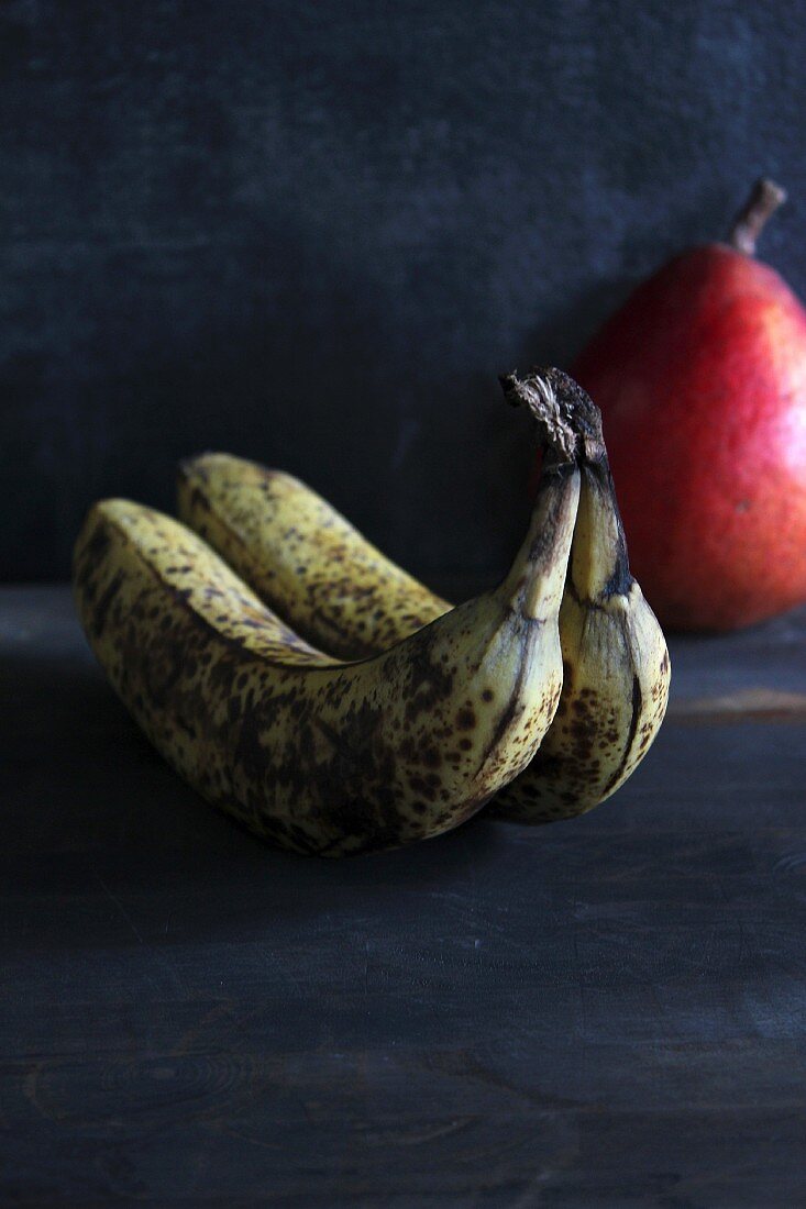 Old bananas with a pear