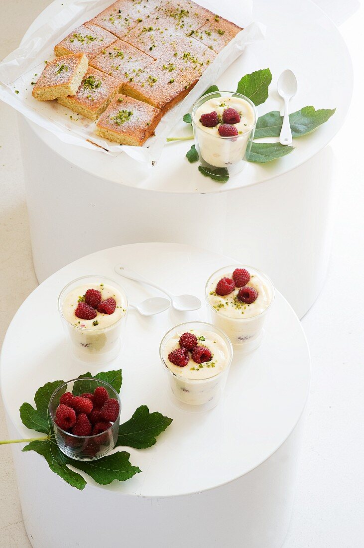 Lemon and pistachio cake and lemon cream with raspberries