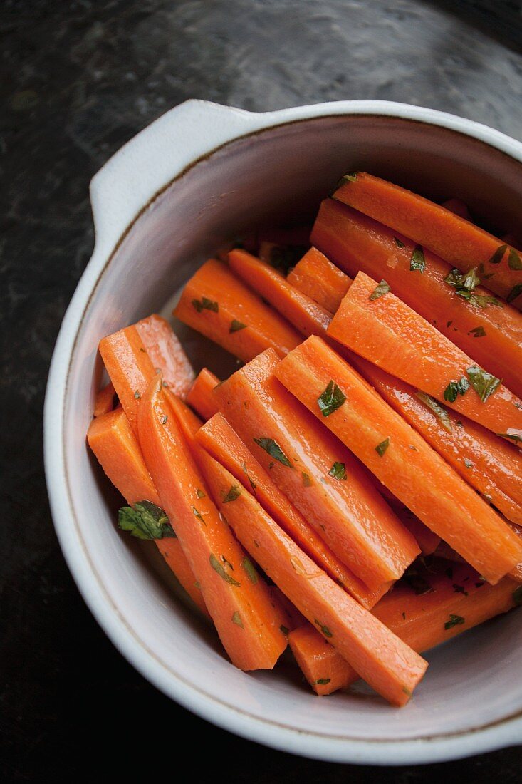 Herb carrots in a saucepan