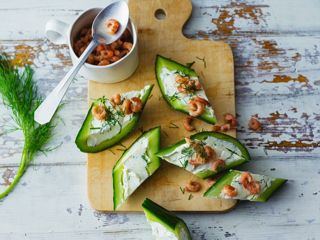 Cucumber canapés filled with cream cheese and North Sea shrimps
