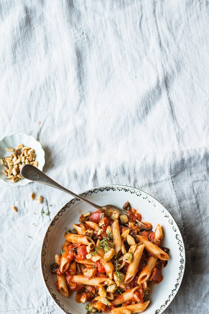 Penne with artichokes, tomatoes and pine nuts