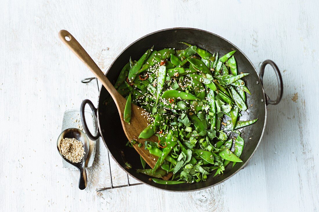 Stir-fried sesame seed mange tout with ginger, chilli and spring onions