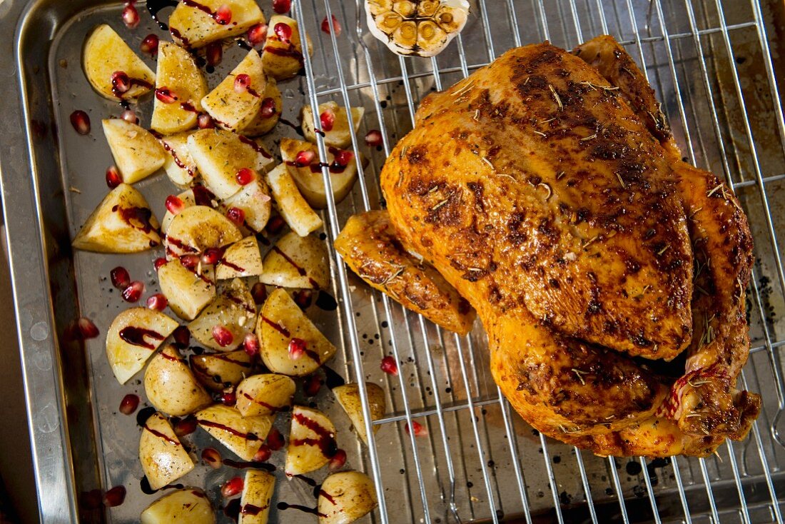 Roast chicken with balsamic potatoes and pomegranate seeds