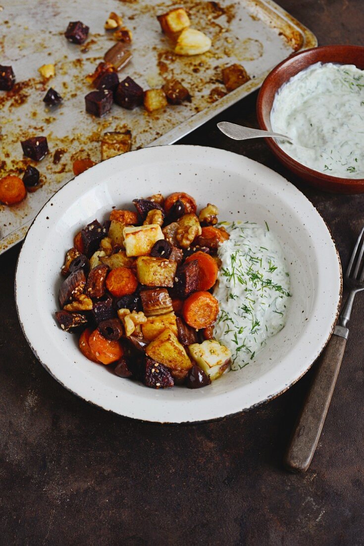 Colourful oven-roasted vegetables with tzatziki from Greece