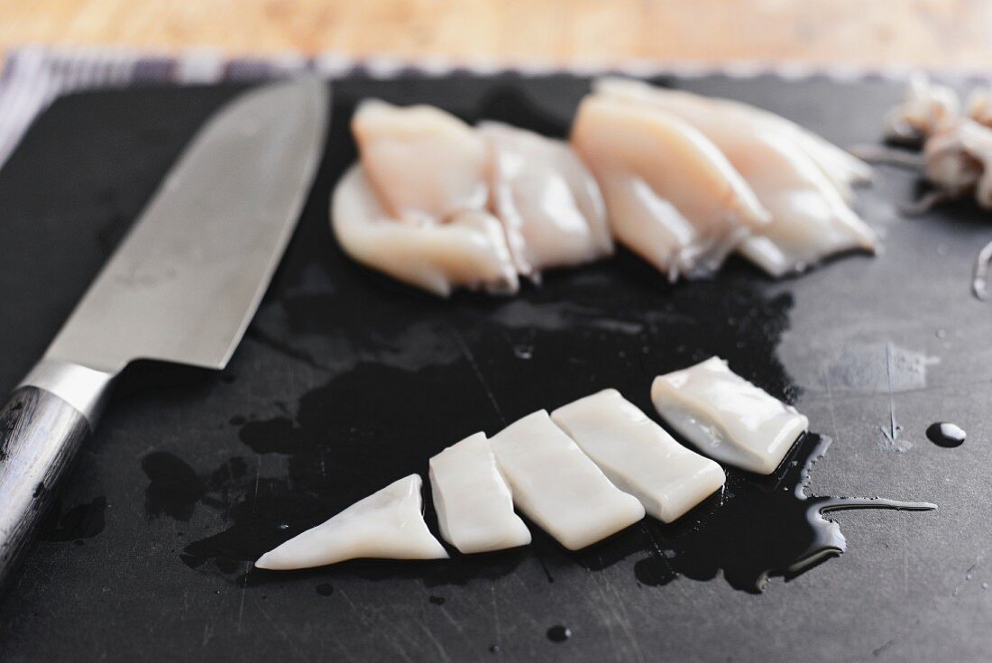 Skinned calamari tubes cut into strips