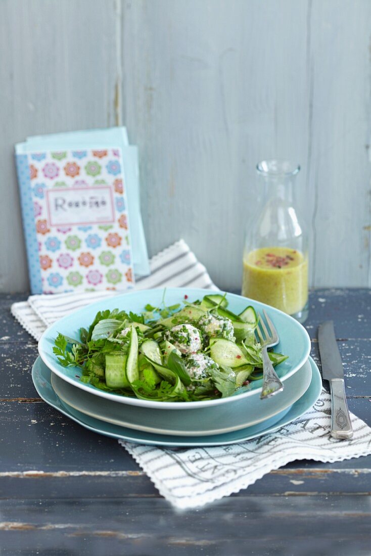 Buckwheat balls on a cucumber salad with fresh chervil