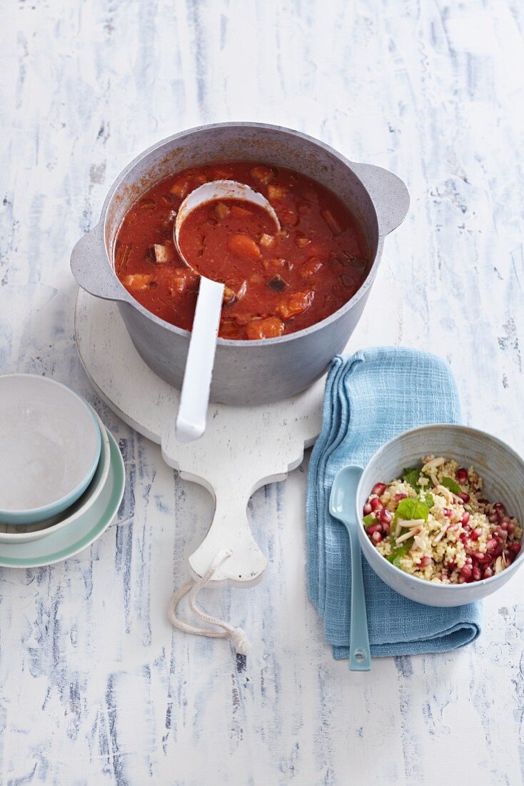 Oriental tomato soup with aubergines and apricots with a millet and pomegranate salad
