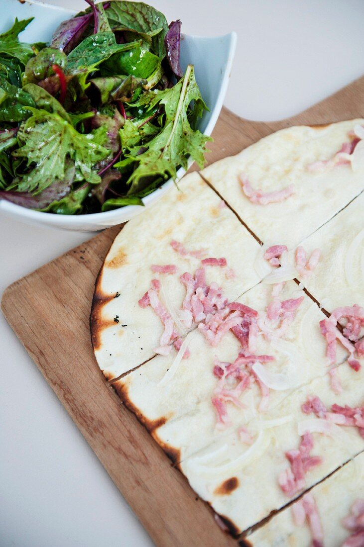 Tarte flambée with a side salad (Alsace speciality)