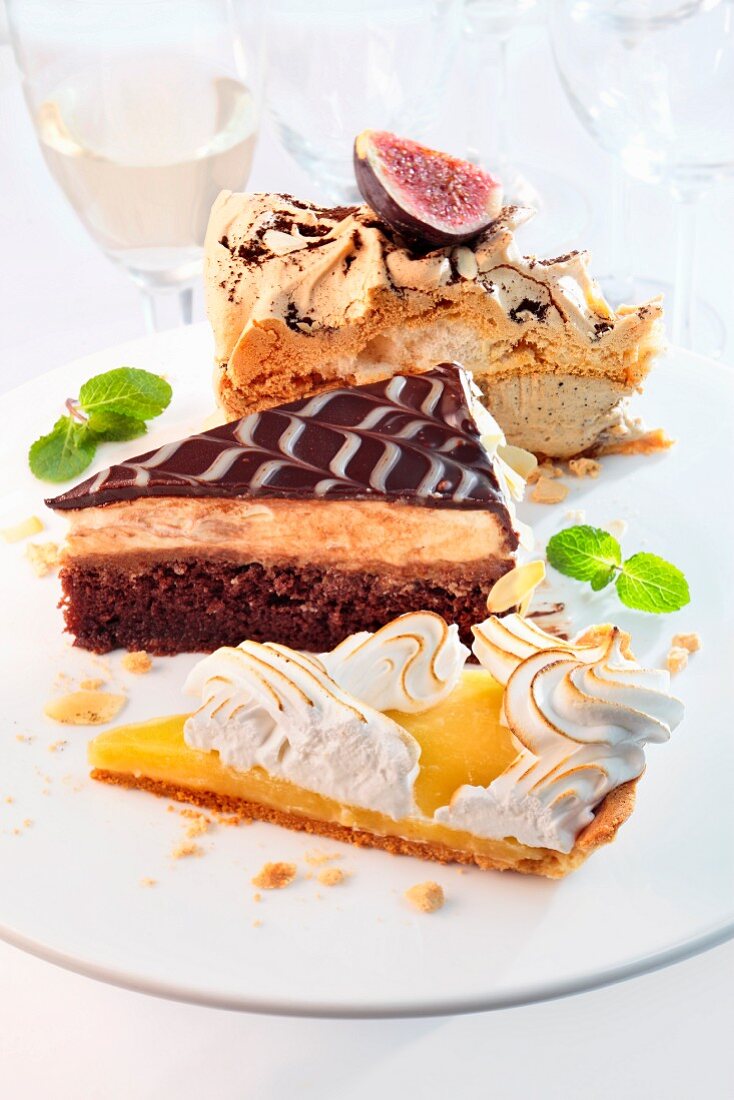 Various slices of cake on a white porcelain plate