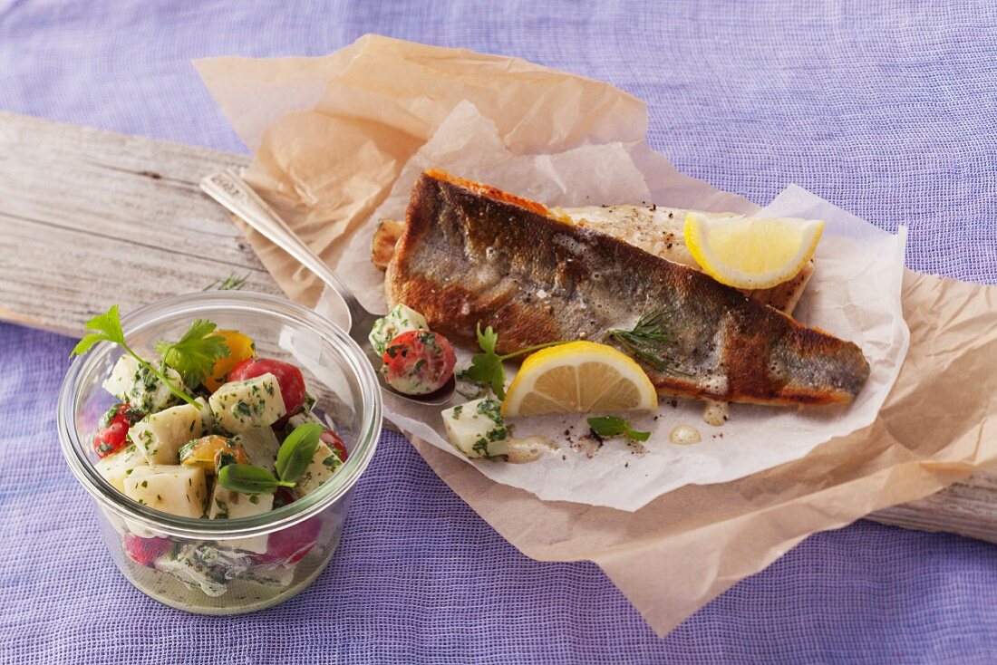 Fried trout fillets with a celery and tomato salad