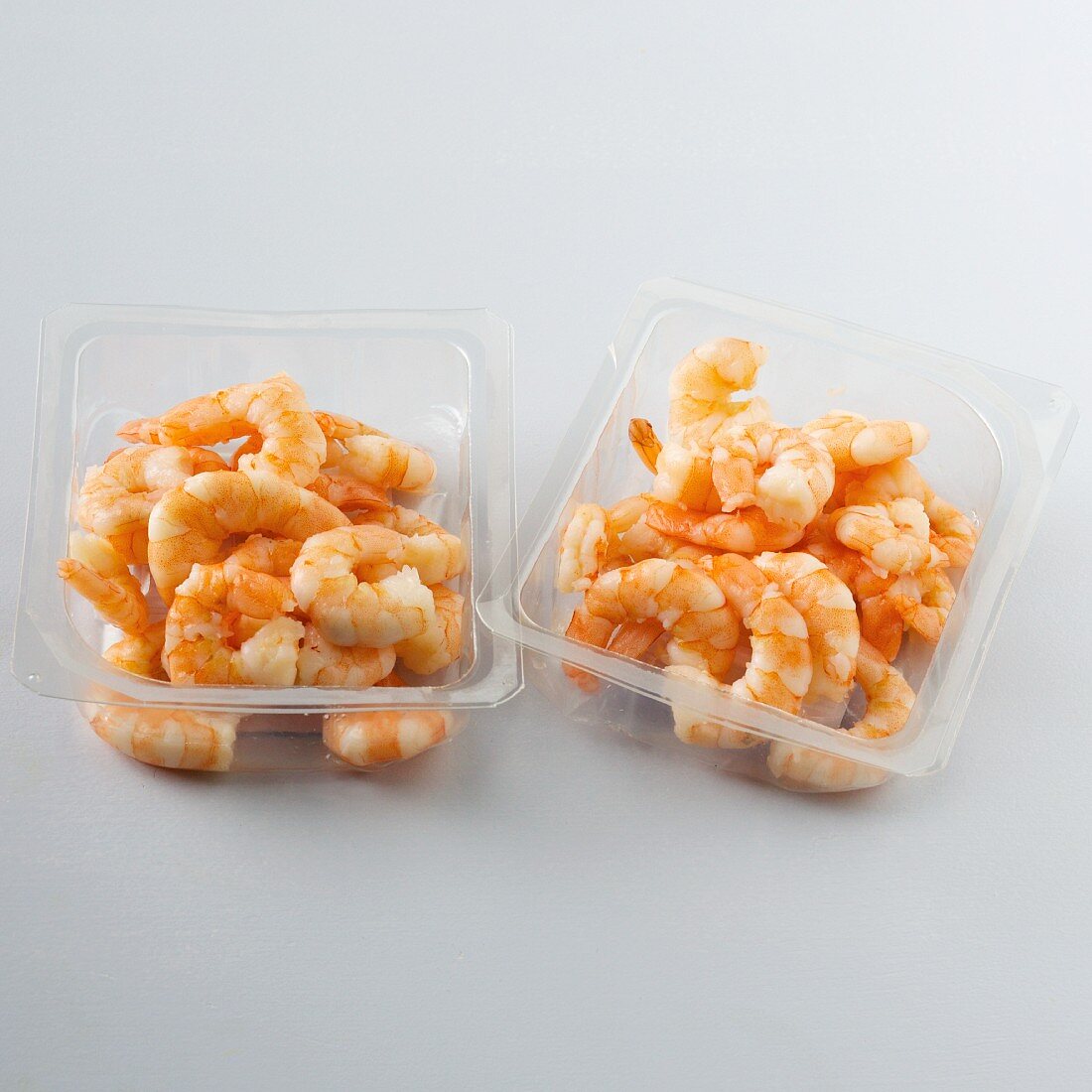 Cooked prawns in plastic dishes