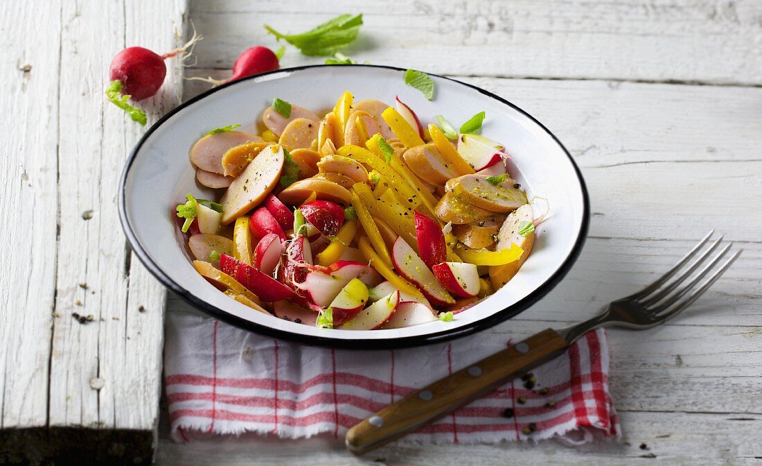 Sausage salad with radishes and peppers