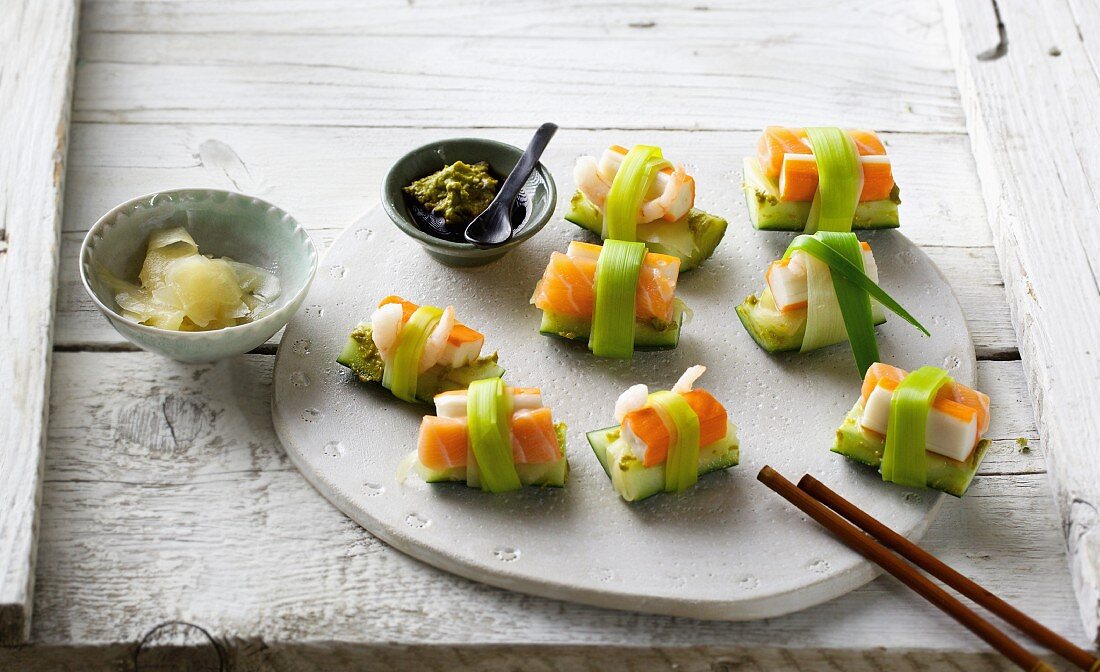 Sushi with surimi and cucumber tied with leek