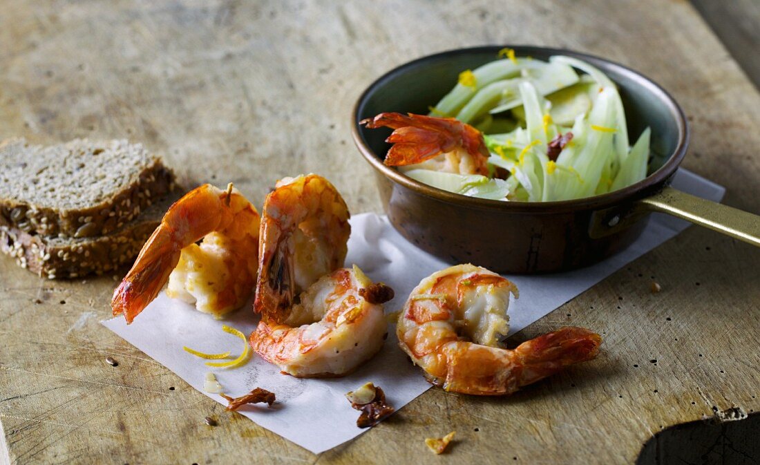Fried king prawns with dried tomatoes and fennel