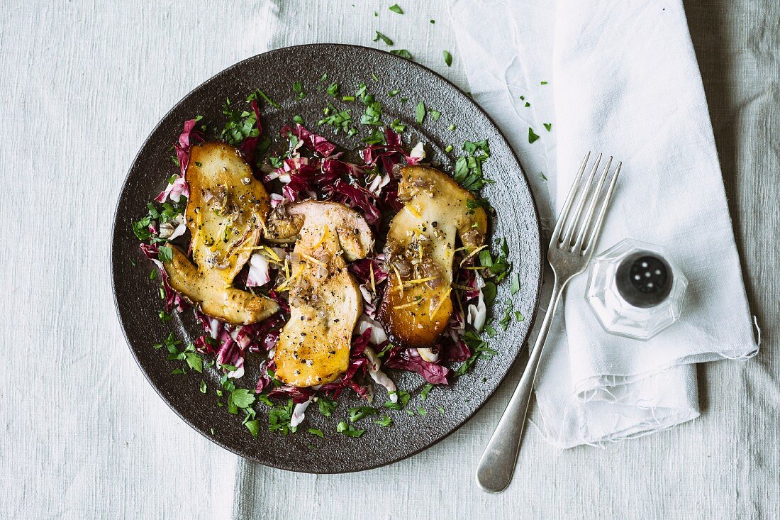 Porcini mushroom carpaccio on a bed of readicchio