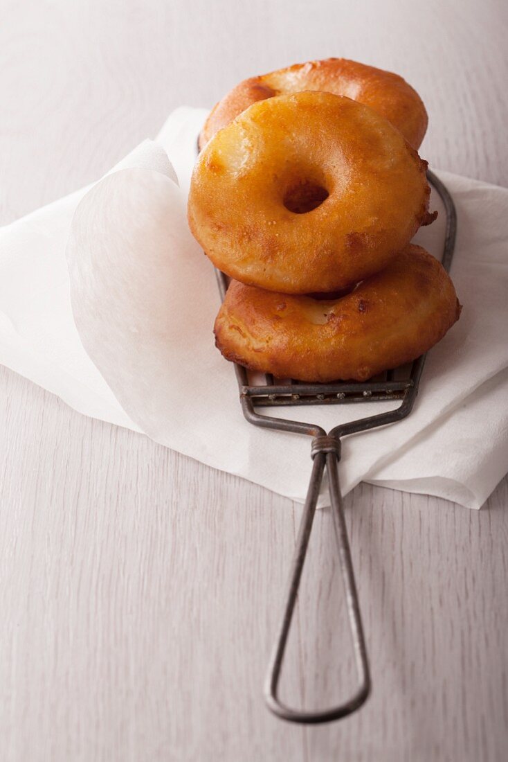 Apple doughnuts on a piece of kitchen paper