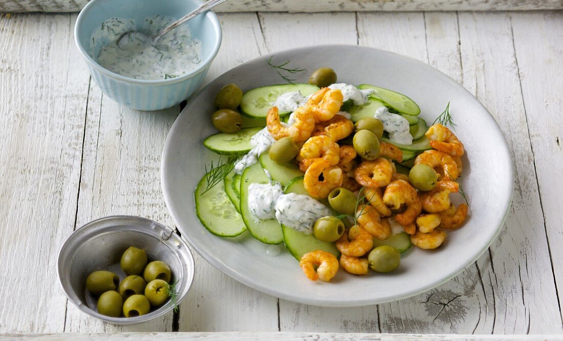 Cucumber carpaccio with chilli prawns and green olives
