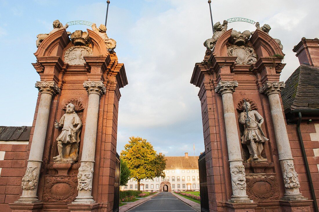 Two pillars with two mercenaries as guards at the entrance gate to Schloss Corvey, Höxter, East Westphalia