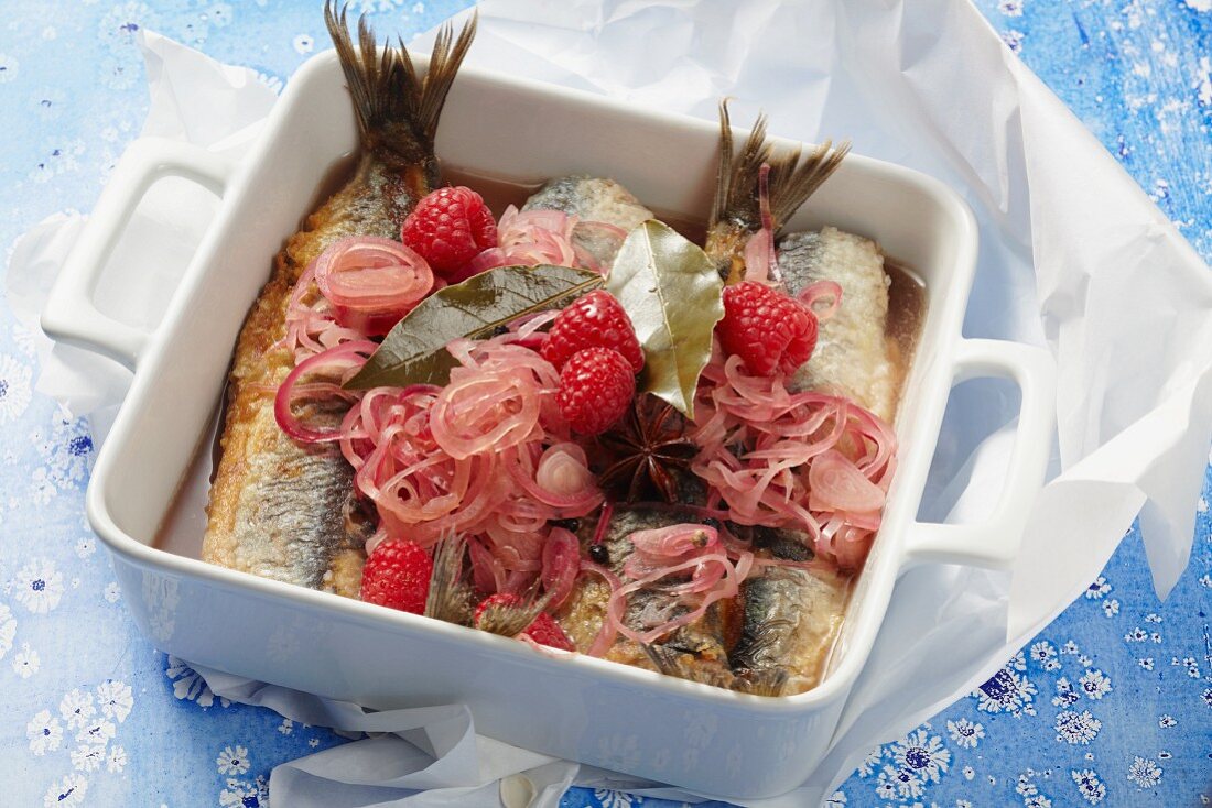 Fried herring in a spiced raspberry broth with onions