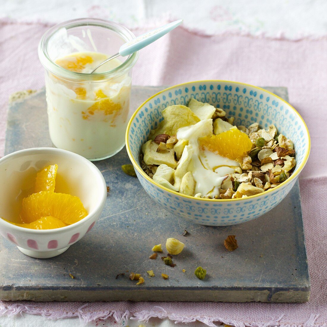 Walnut and pistachio muesli with oranges and soy yoghurt
