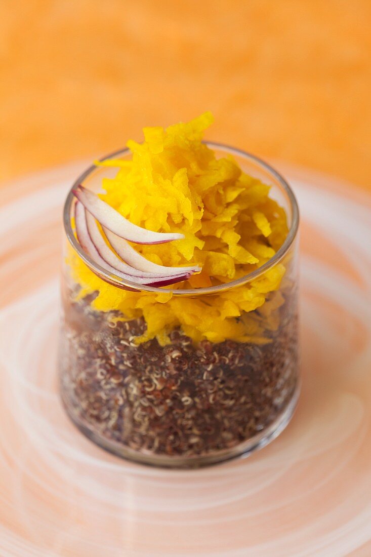 Grated yellow beets on quinoa