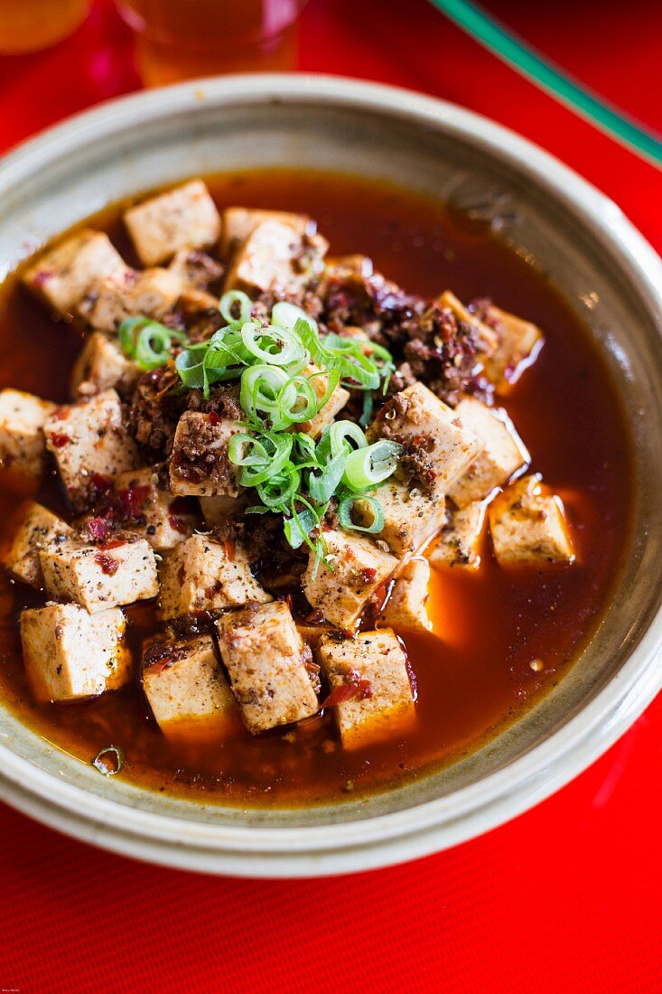 Tofu in a tangy sauce with minced meat, spicy bean paste, chilli and Szechuan pepper