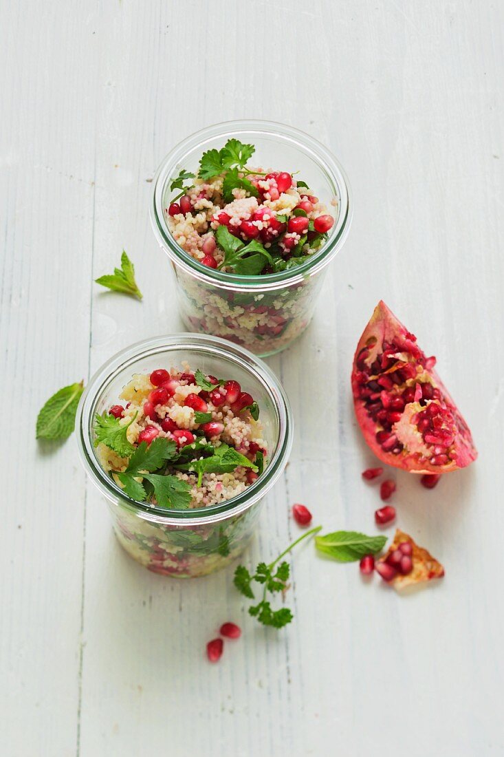 Couscous salad with pomegranate seeds, parsley and mint