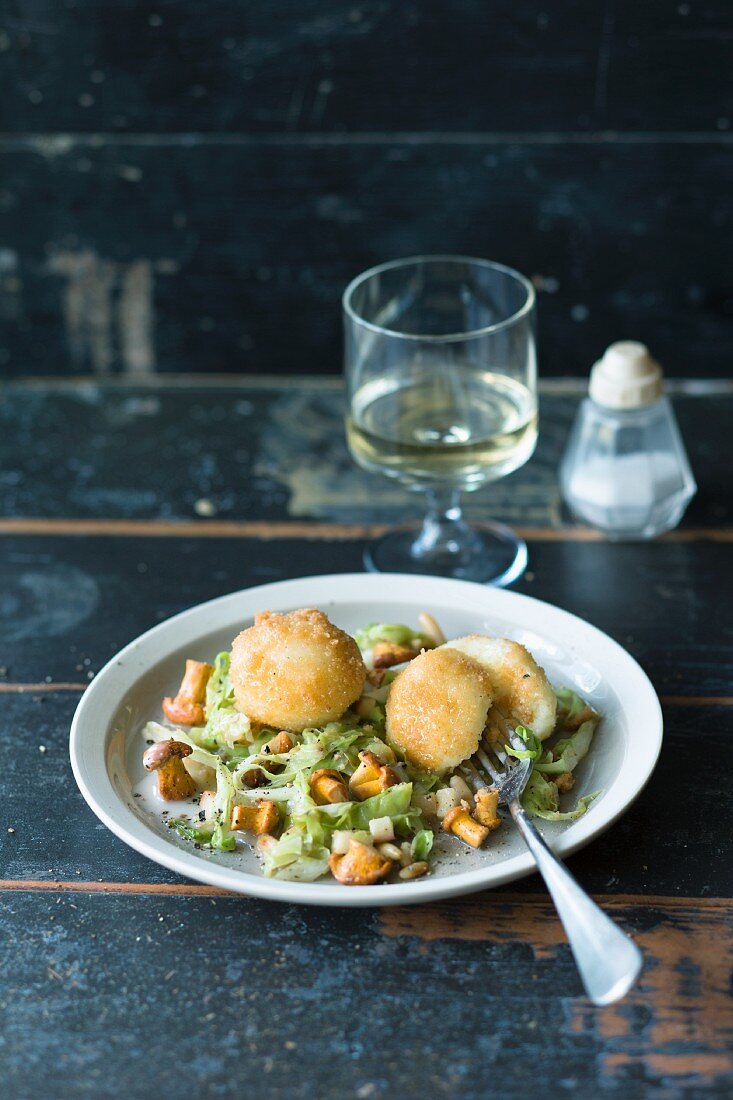 Mini potato dumplings with pointed cabbage and chanterelle mushrooms