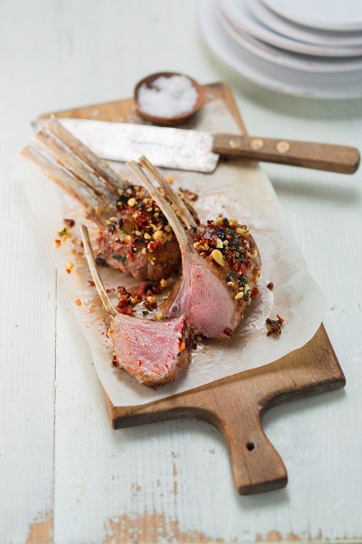 Saddle of lamb with tomatoes, olives and pine nuts