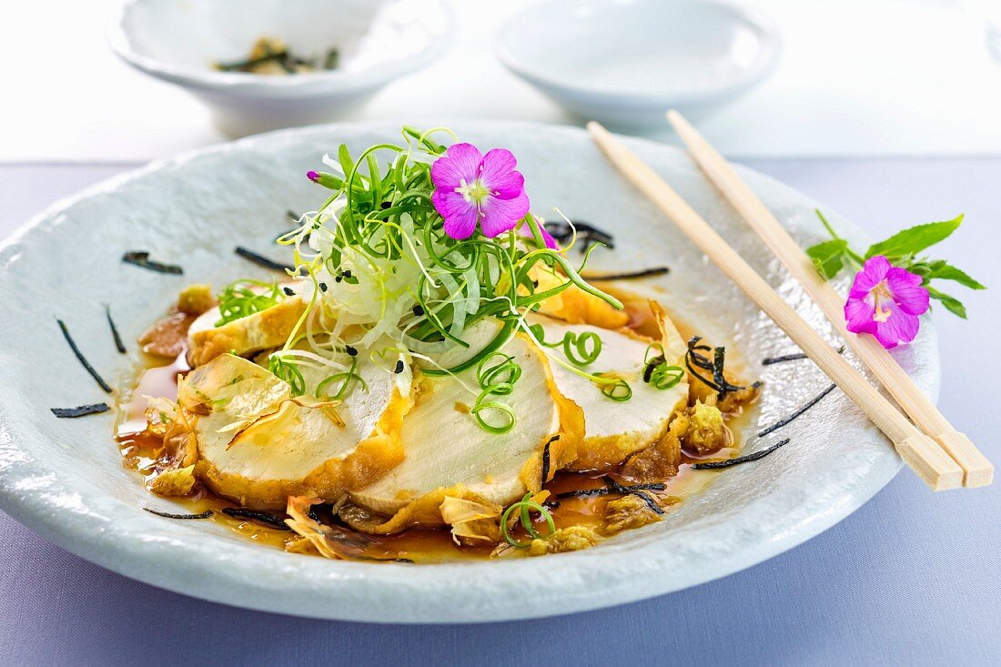 Fried tofu with edible flowers (Asia)