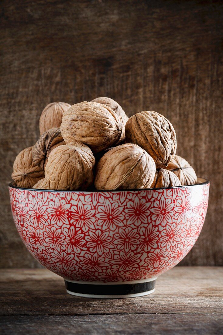 Walnuts in a floral-patterned bowl