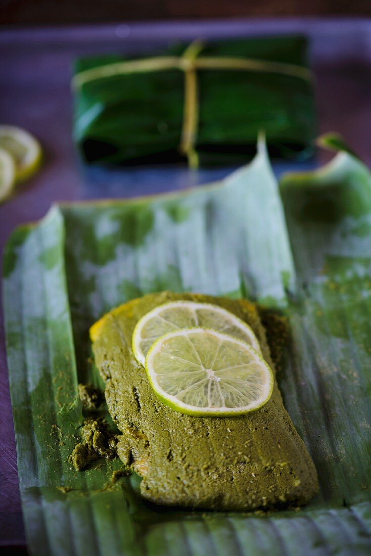 Fish in a herb and chilli marinade wrapped in a banana leaf