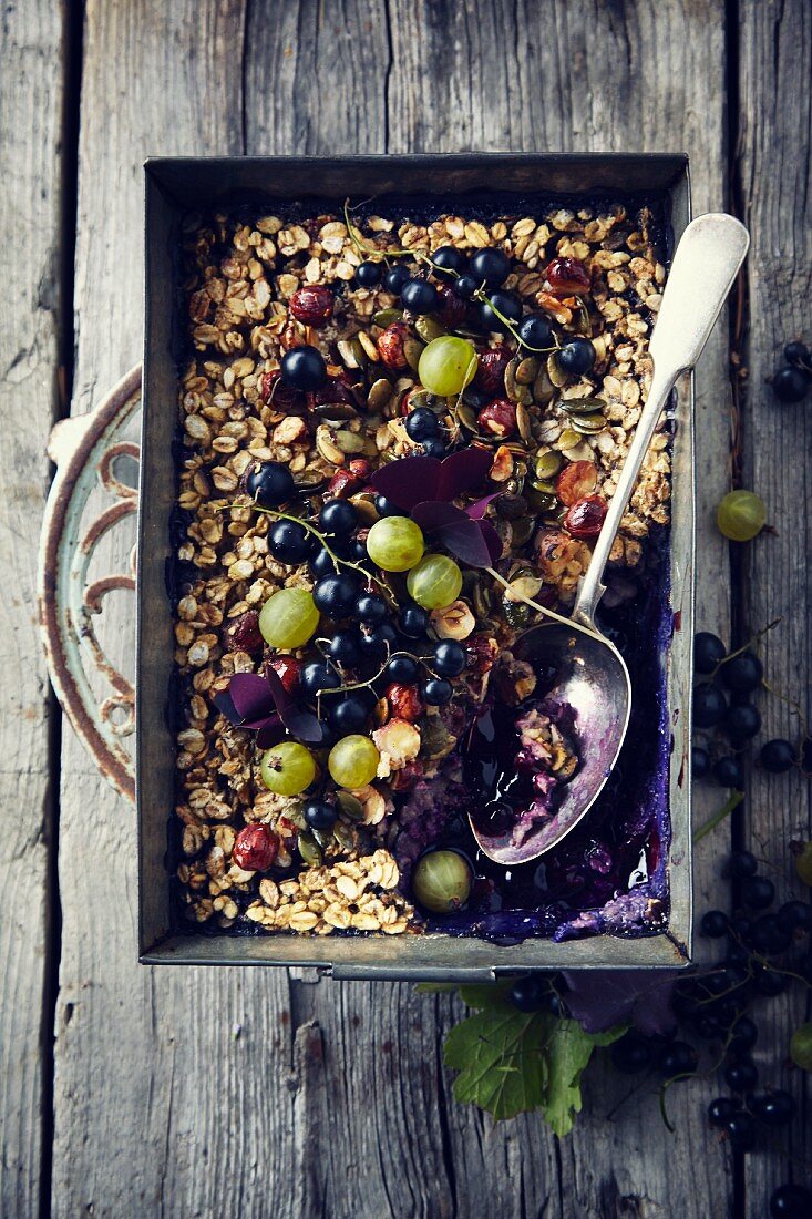 Baked oats with gooseberries and blackcurrants