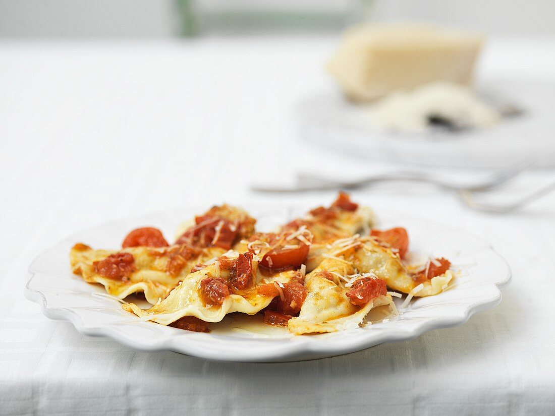 Ravioli with tomatoes and Parmesan cheese