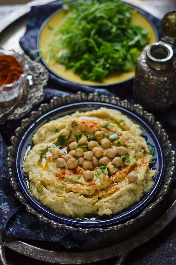 Hummus with whole chickpeas, spices and herbs