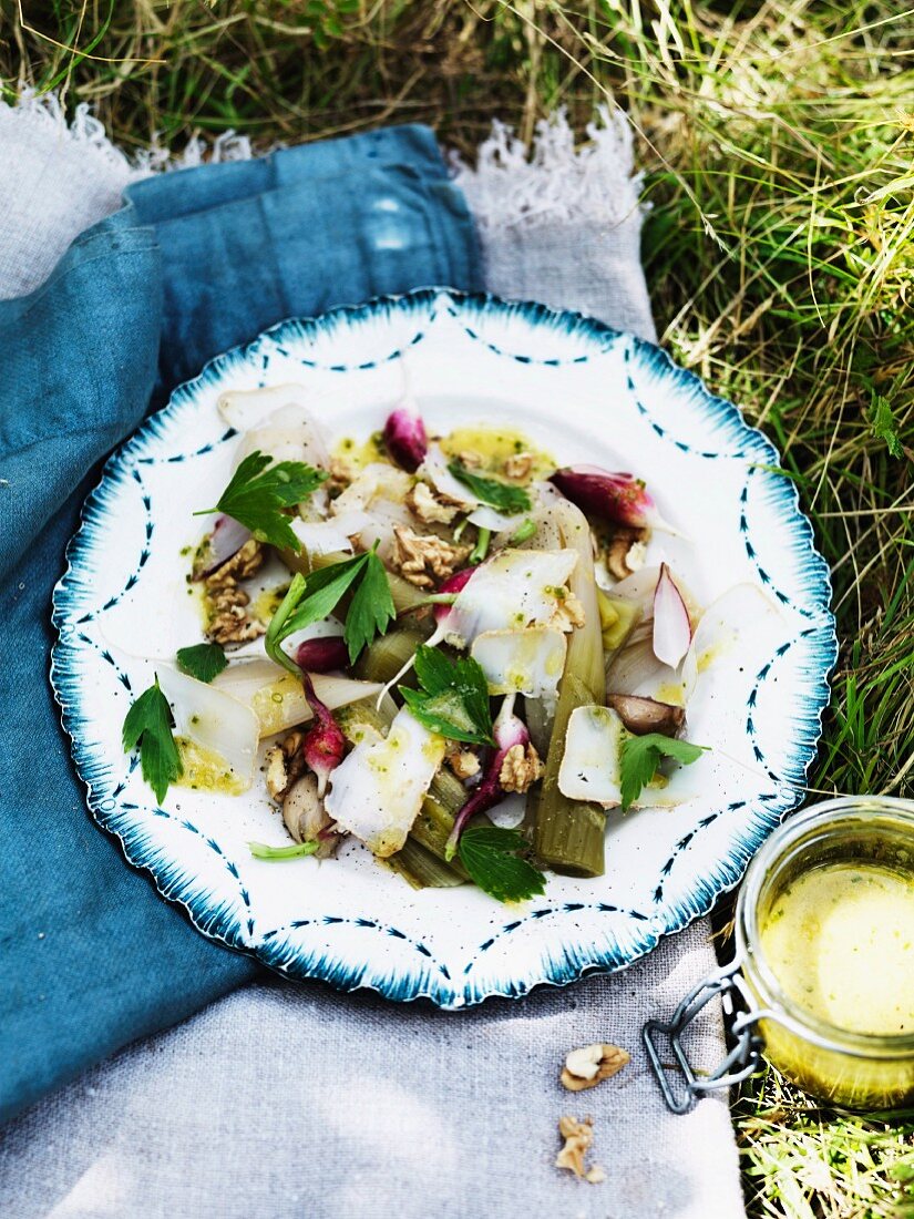 Salad with poached leek, radish, walnut and goat cheese