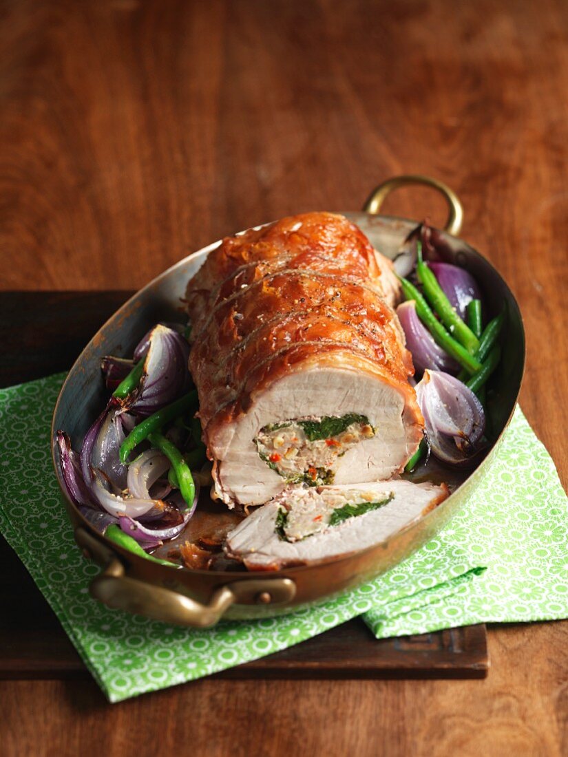 Roast pork roulade with pancetta, spinach and lemon