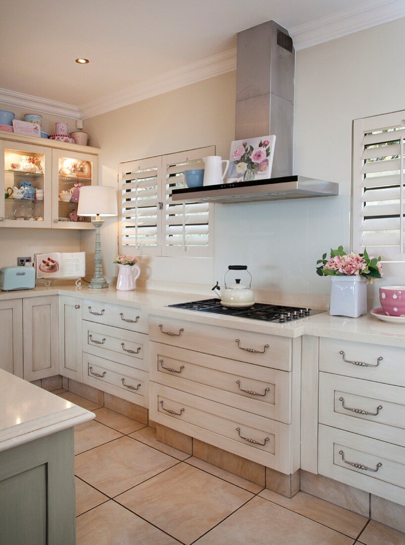 Cream kitchen with pastel accessories – License image – 11353948 ❘ Image  Professionals