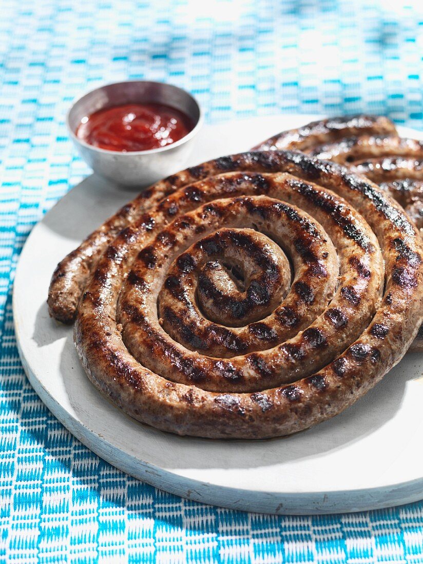 Grilled sausage spirals with ketchup