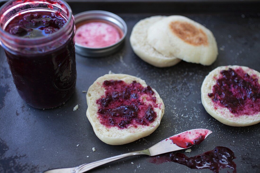 Homemade blueberry jam with freshly baked English muffins